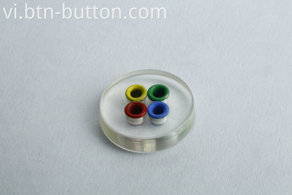 Four-hole color transparent button